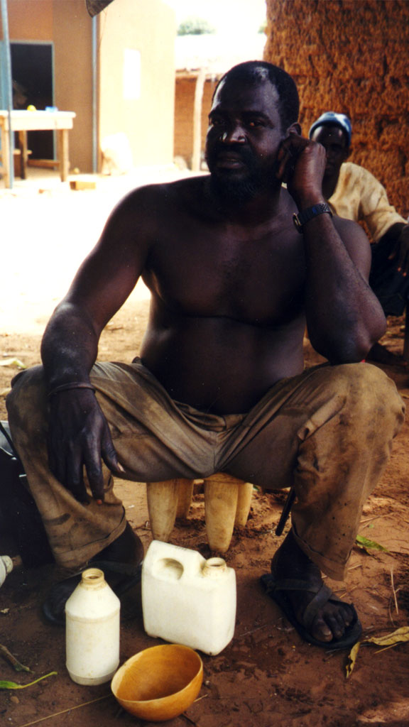 man sitting on stool