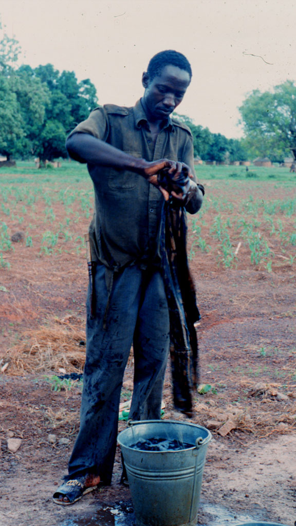 man rinsing cloth