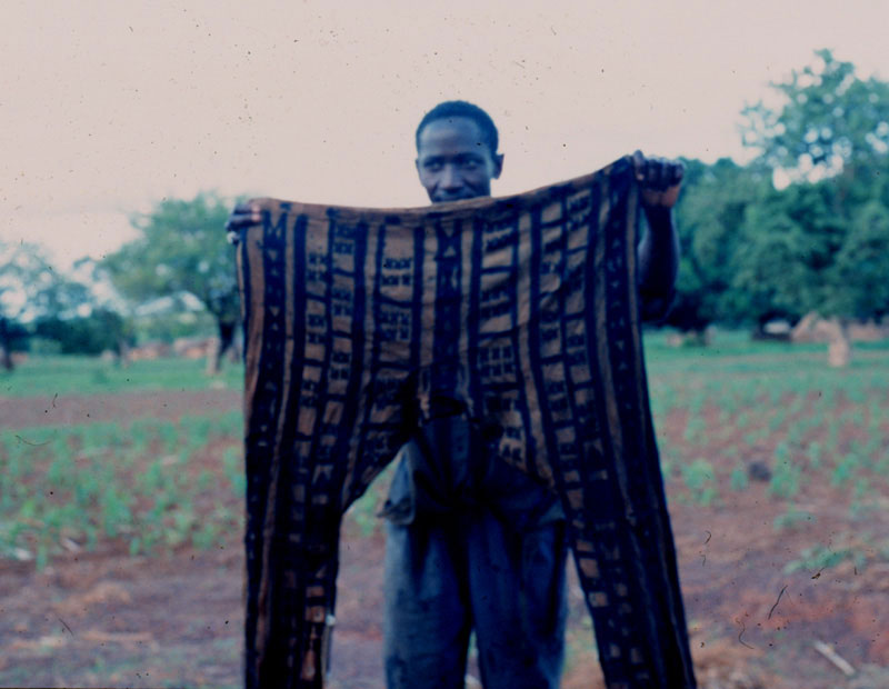 man holds up his designed pants